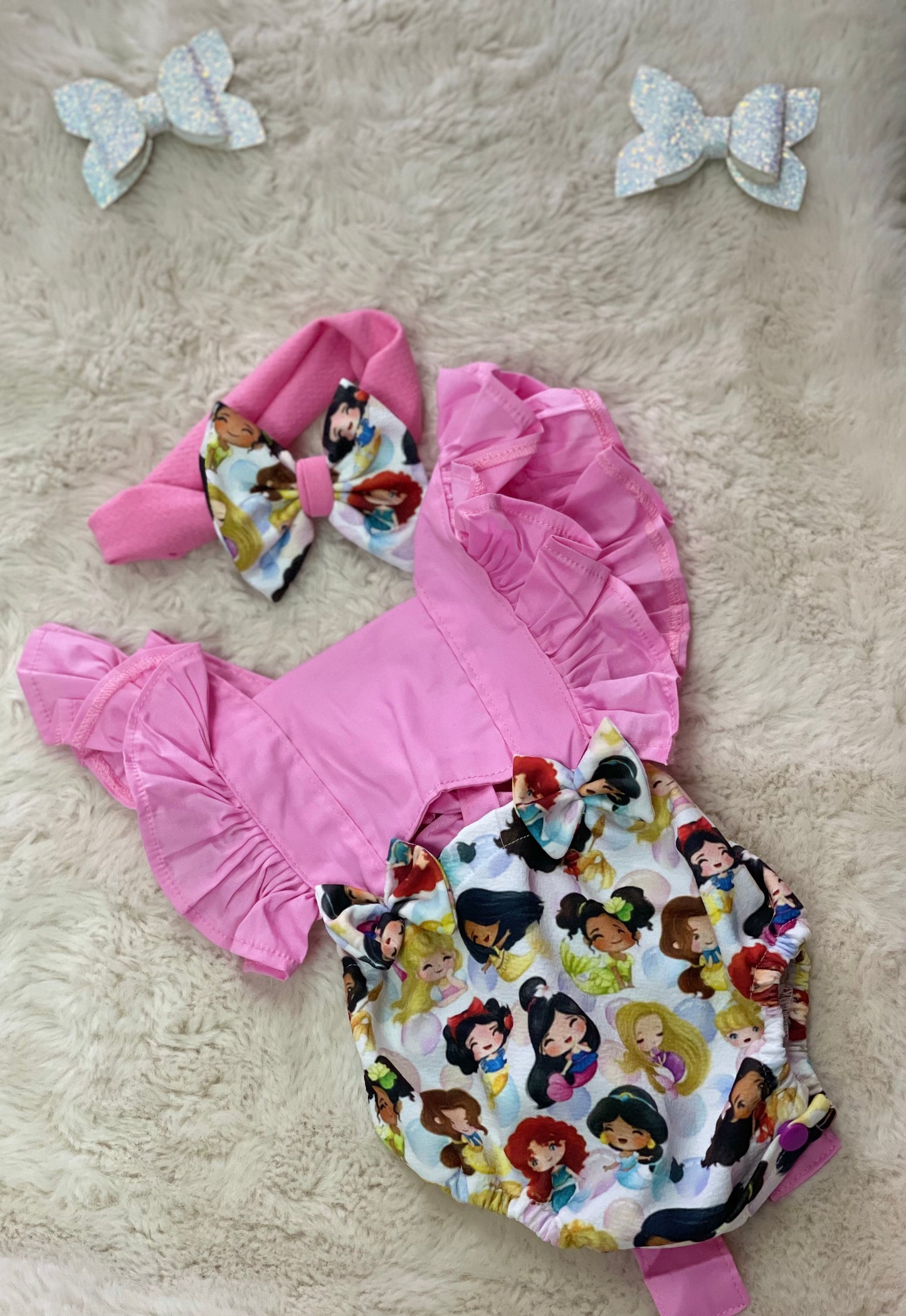 Pink baby bodysuit with matching bow